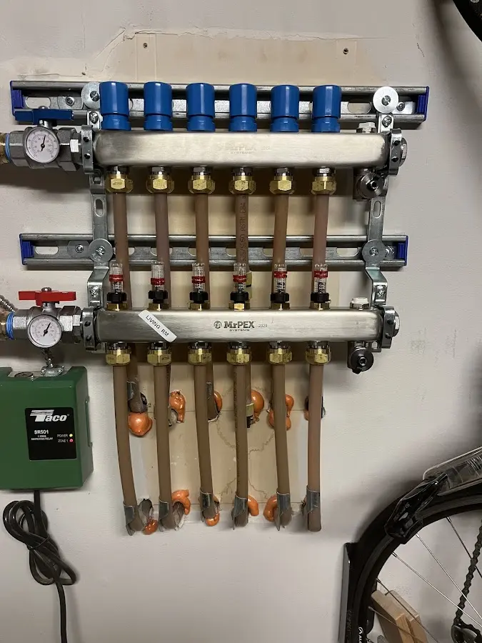 Plumber performing Water Heater Repair at a residential property in Ulster